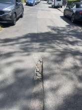 Schlagloch Wüllnerstr./Behringstr. Unfallgefahr für Radfahrer
